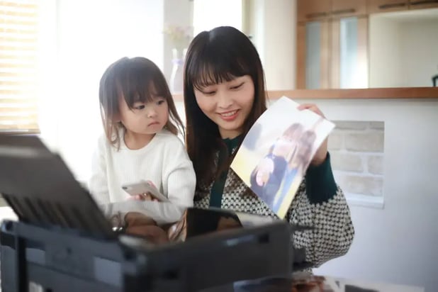 Colleagues sharing a cloud printer in a collaborative workspace