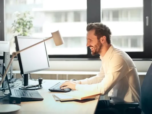 man-happy-on-computer
